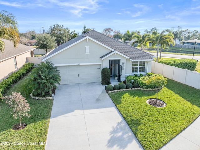 ranch-style home featuring a garage and a front lawn