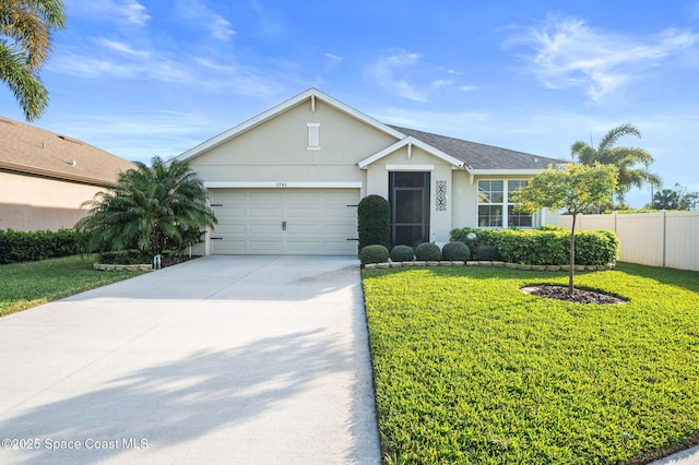 ranch-style house featuring a garage and a front yard