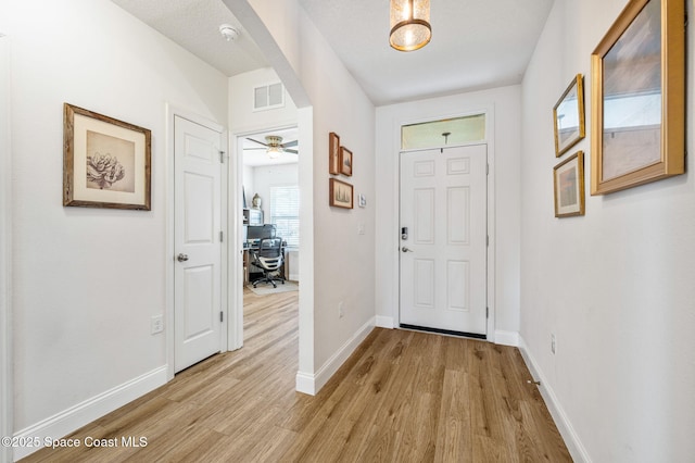 entryway with light hardwood / wood-style floors