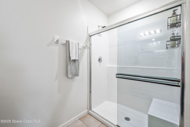 bathroom featuring tile patterned flooring and an enclosed shower