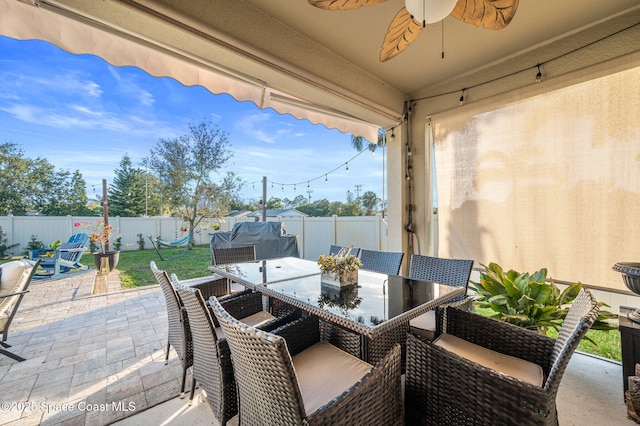 view of patio with ceiling fan and a grill