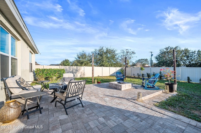 view of patio / terrace featuring a fire pit