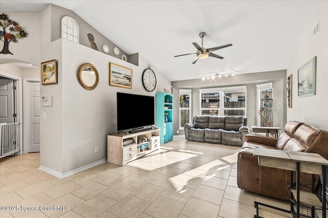 tiled living room with high vaulted ceiling and ceiling fan