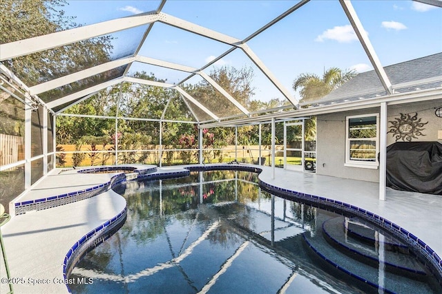 view of swimming pool featuring a patio, a grill, an in ground hot tub, and glass enclosure