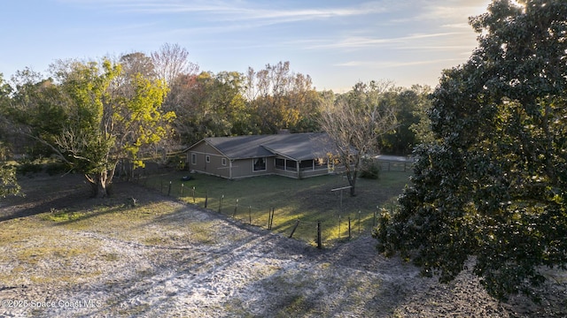 birds eye view of property with a rural view