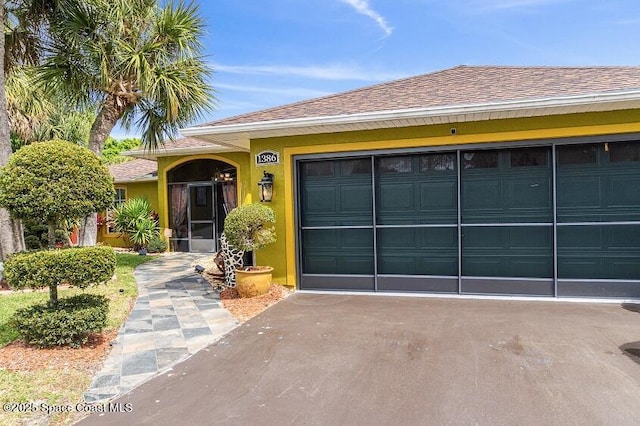 single story home featuring a garage