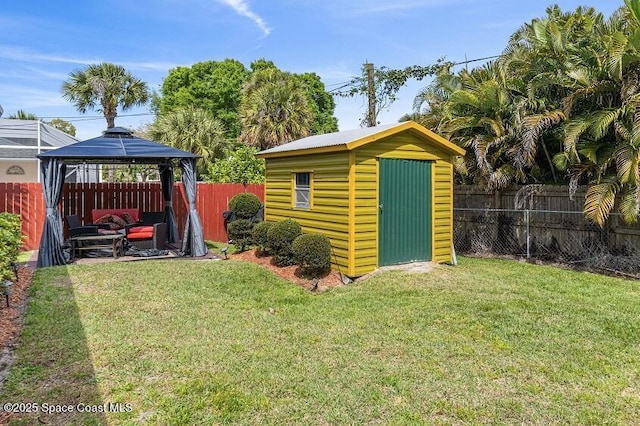 view of yard with a gazebo and a storage shed