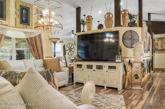 living room featuring hardwood / wood-style floors and ceiling fan