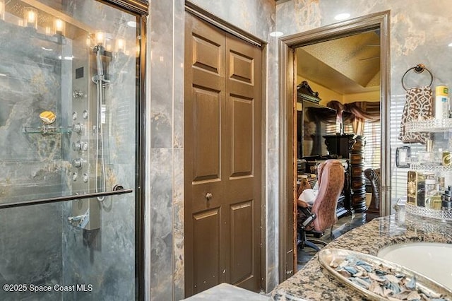 bathroom with vanity and an enclosed shower