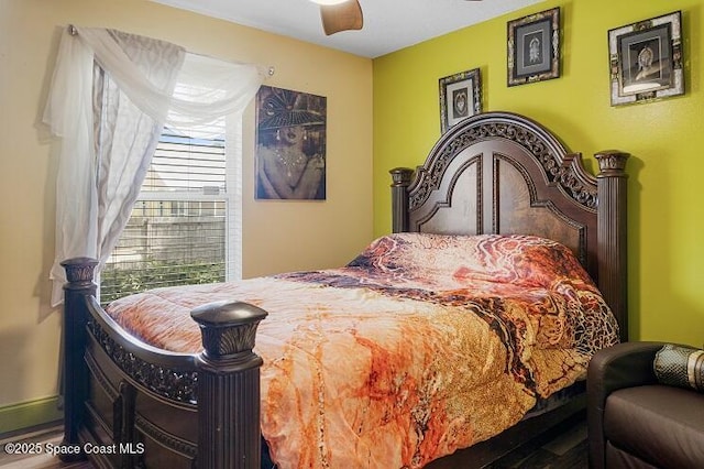 bedroom with wood-type flooring and ceiling fan