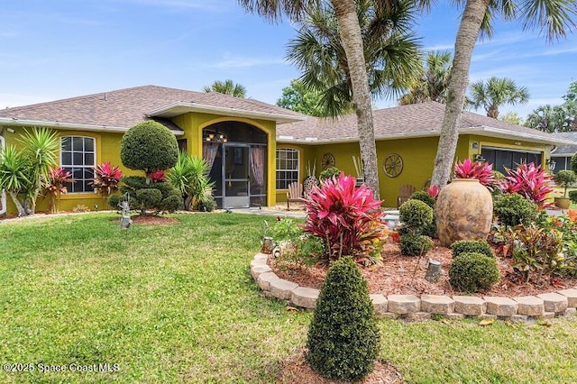 ranch-style home featuring a front yard