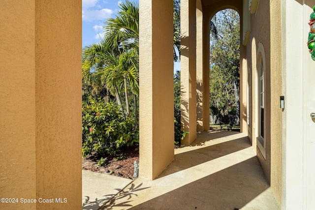 view of exterior entry featuring a patio area