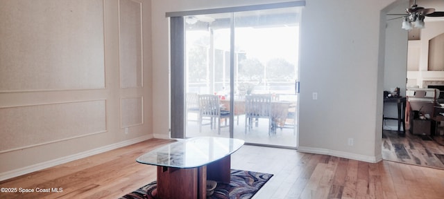 interior space with ceiling fan and light wood-type flooring