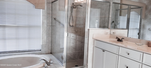 bathroom featuring vanity and plus walk in shower