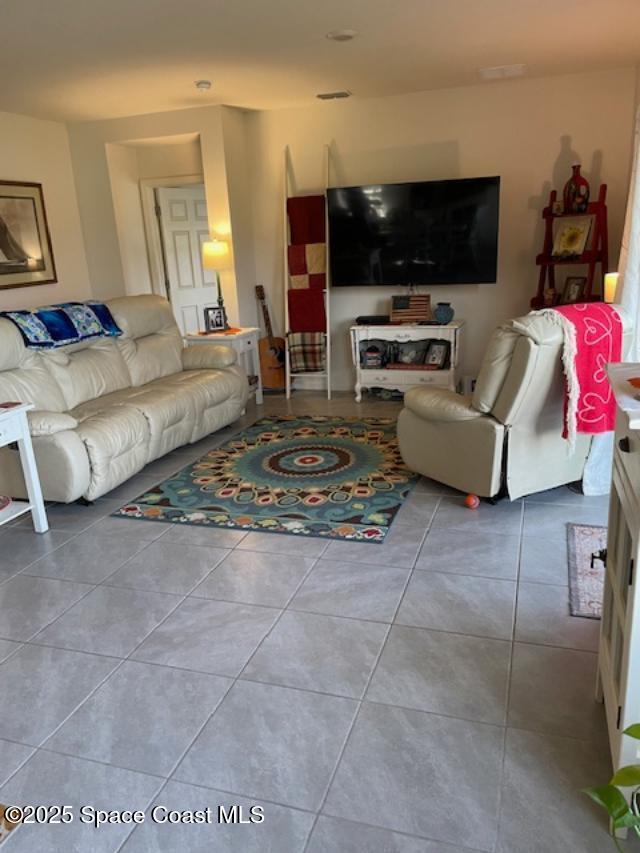 living room featuring tile patterned flooring