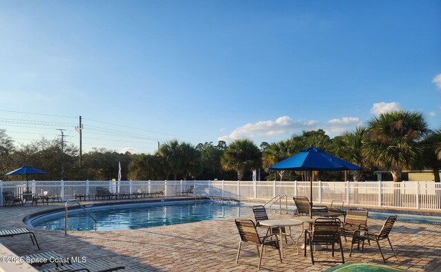 view of pool featuring a patio