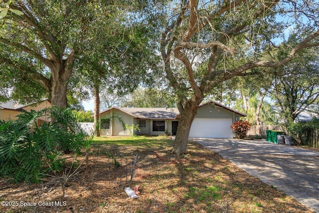 ranch-style house featuring a garage