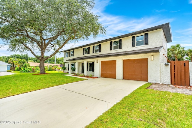 view of front of house with a garage and a front yard