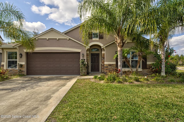 view of front of house with a garage and a front yard