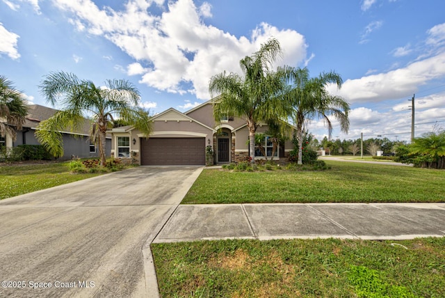 view of front of house featuring a garage and a front yard