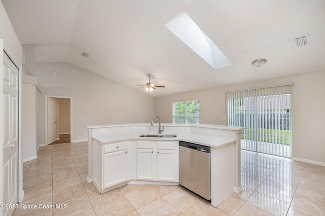 kitchen with white cabinetry, an island with sink, dishwasher, and sink