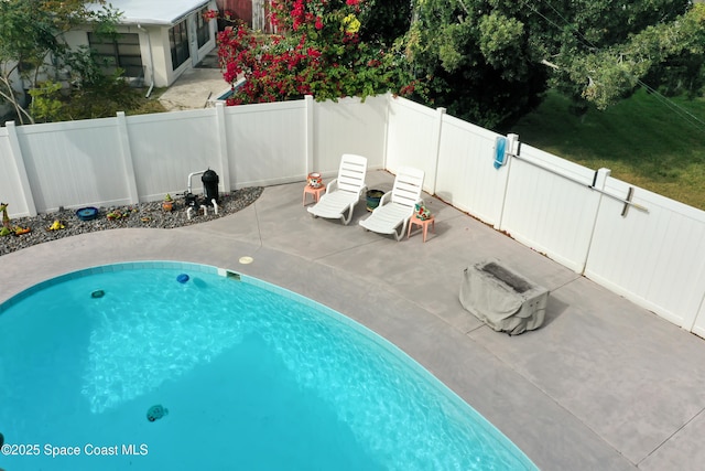 view of swimming pool featuring a patio area