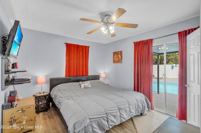 bedroom featuring access to outside, light hardwood / wood-style floors, and ceiling fan