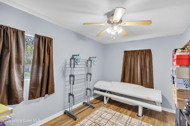 bedroom with ceiling fan and light hardwood / wood-style flooring