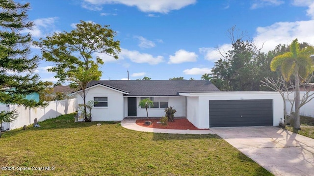 ranch-style home featuring a garage and a front yard