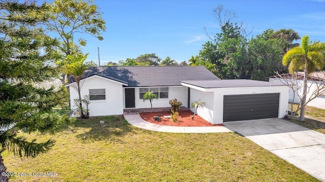 single story home with a garage and a front lawn