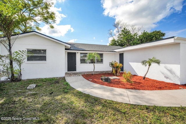 ranch-style house with a front yard