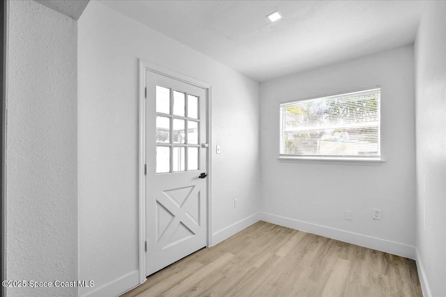 doorway featuring light hardwood / wood-style floors