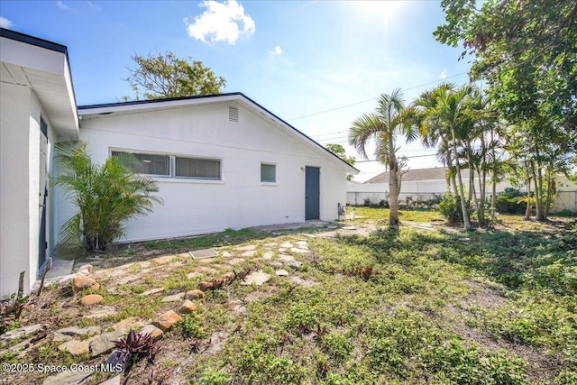 view of property exterior featuring a yard