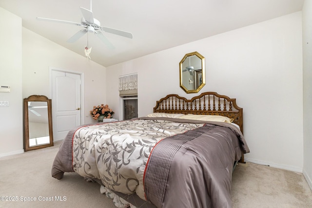 carpeted bedroom featuring baseboards, lofted ceiling, and ceiling fan