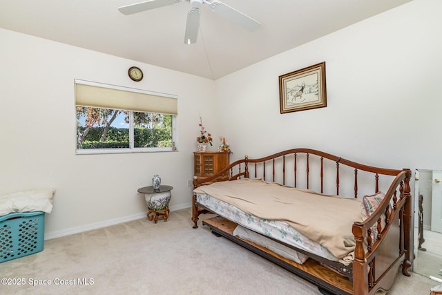 bedroom with baseboards, ceiling fan, carpet flooring, and vaulted ceiling