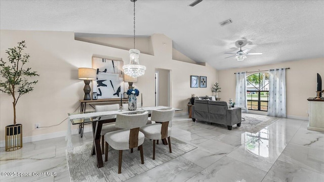 dining space with lofted ceiling, ceiling fan with notable chandelier, and a textured ceiling