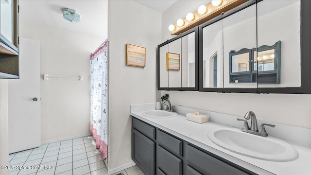 bathroom with vanity and tile patterned floors