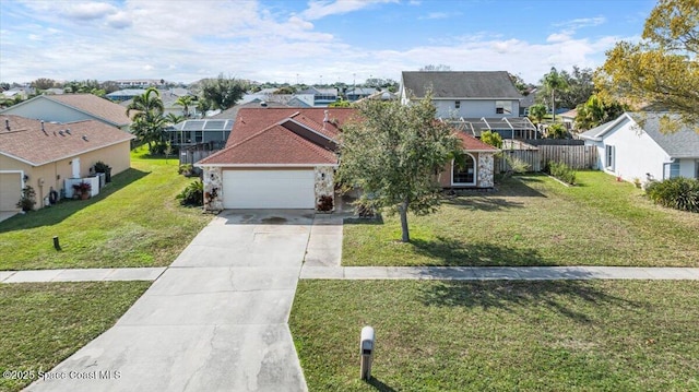 view of front of property with a garage and a front yard