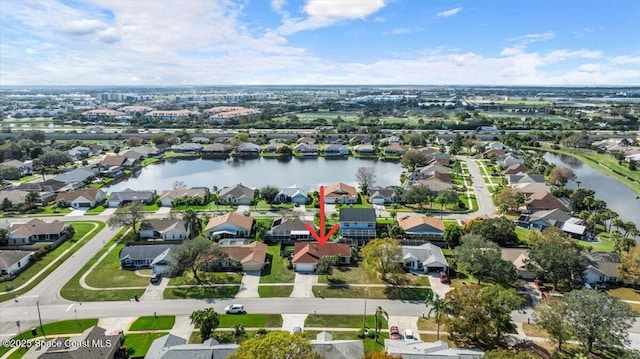 birds eye view of property featuring a water view