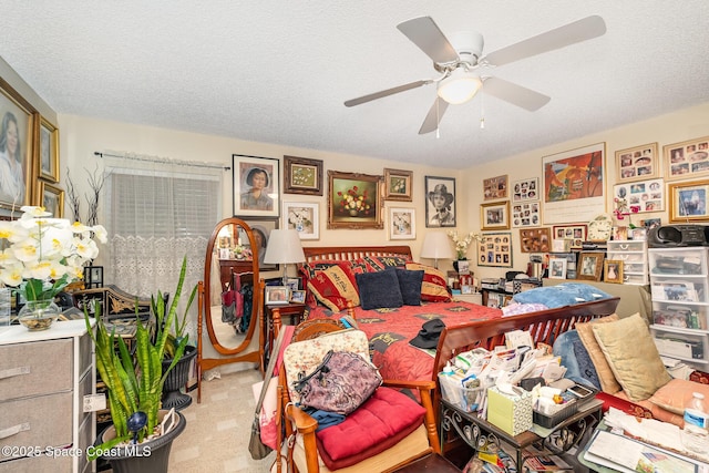 interior space with light carpet, ceiling fan, and a textured ceiling