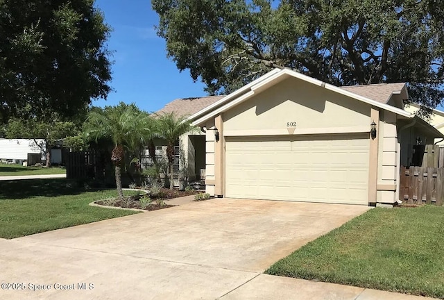 ranch-style house with a garage and a front lawn