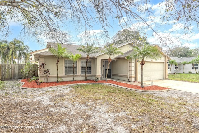 ranch-style house featuring a garage and a front lawn