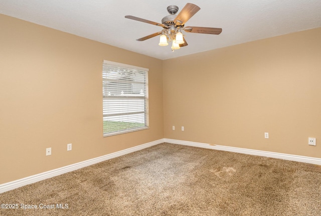 carpeted empty room with ceiling fan