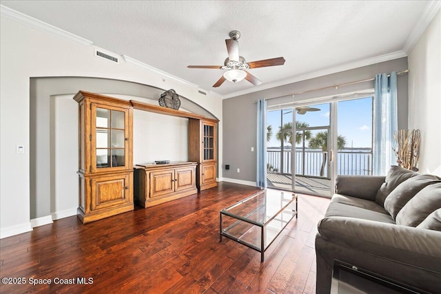 living room with crown molding, wood-type flooring, a textured ceiling, and ceiling fan