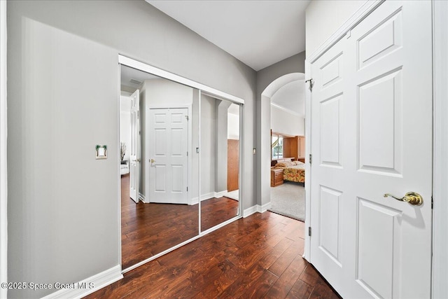 corridor featuring dark hardwood / wood-style floors