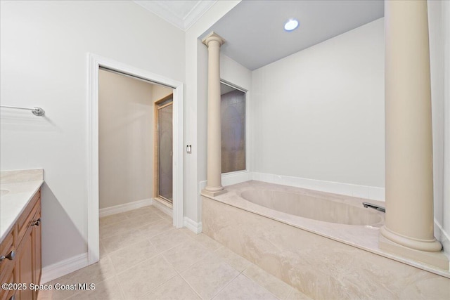 bathroom with vanity, tile patterned floors, and ornate columns