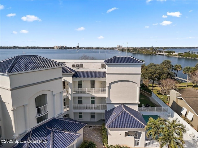 birds eye view of property with a water view