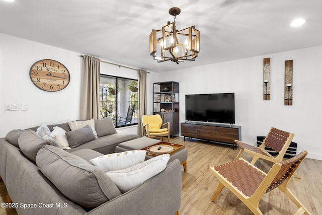 living room featuring hardwood / wood-style floors and a chandelier