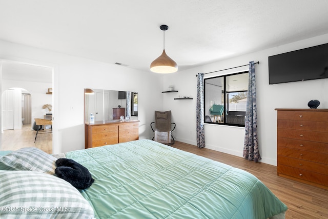 bedroom featuring light wood-type flooring