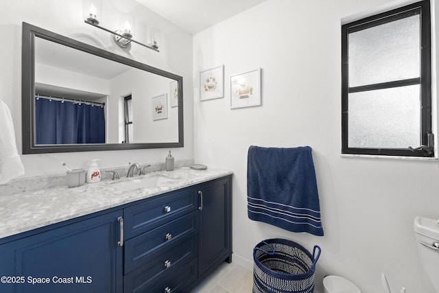 bathroom with vanity and toilet